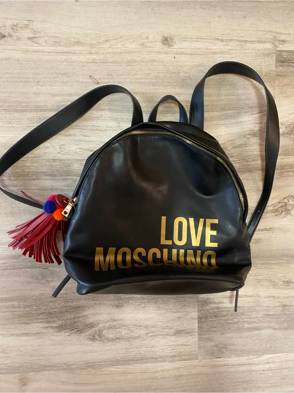 Love Moschino Black Backpack with Gold Logo and Red Tassel